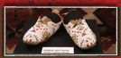 Beaded women's moccasins from the Sioux Lower Brule tribe are sinew-sewn on buffalo hide.