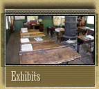 Interior of the school, complete with blackboards and a stove in the center for heat.